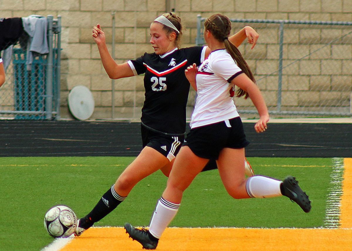 Gabby Knipper gets a step on a West Branch Bear and prepares to send the ball up field during the first half of the Solon Lady Spartans&#8217; 3-0 victory on Monday, May 10, at Spartan Stadium.