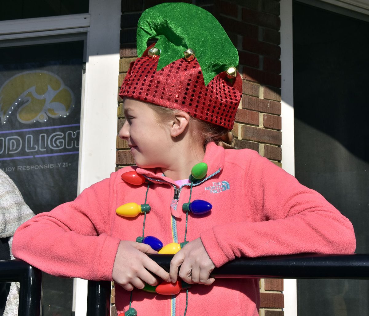 Keeping watch for Santa &#8211; Carley watches for any sign of the big yellow and white fire engine carrying Santa Claus.