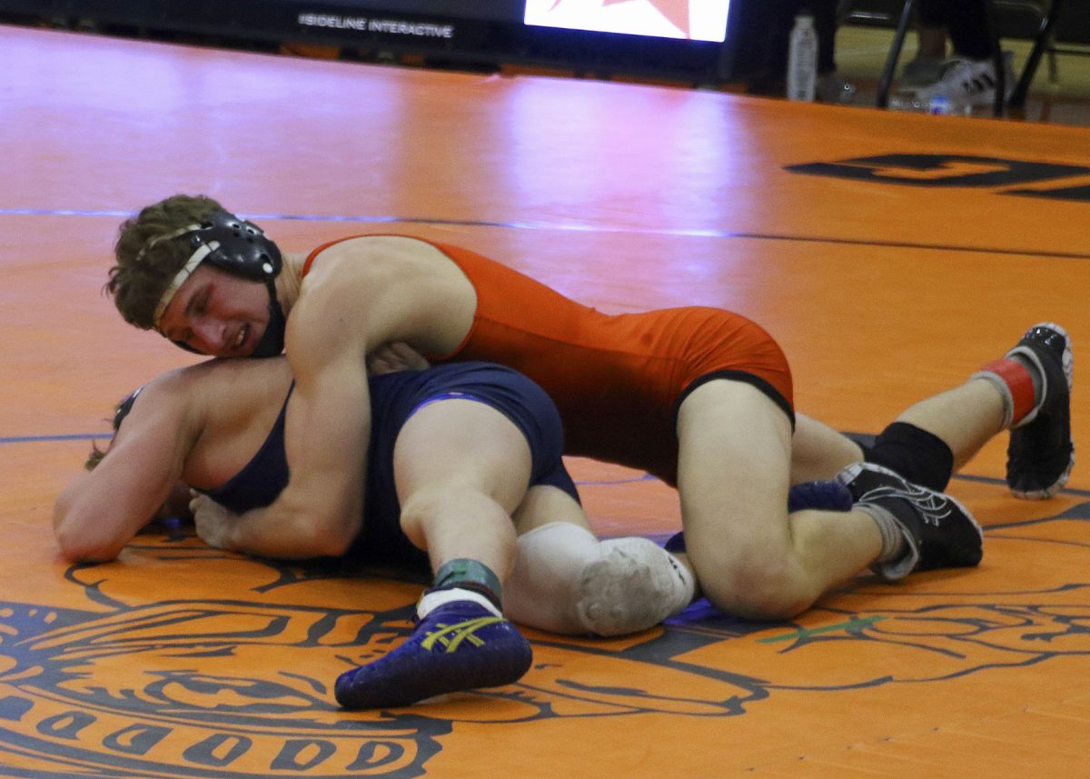 Solon senior Lucas Kampman battles against West Burlington, Notre Dame senior River Belger.