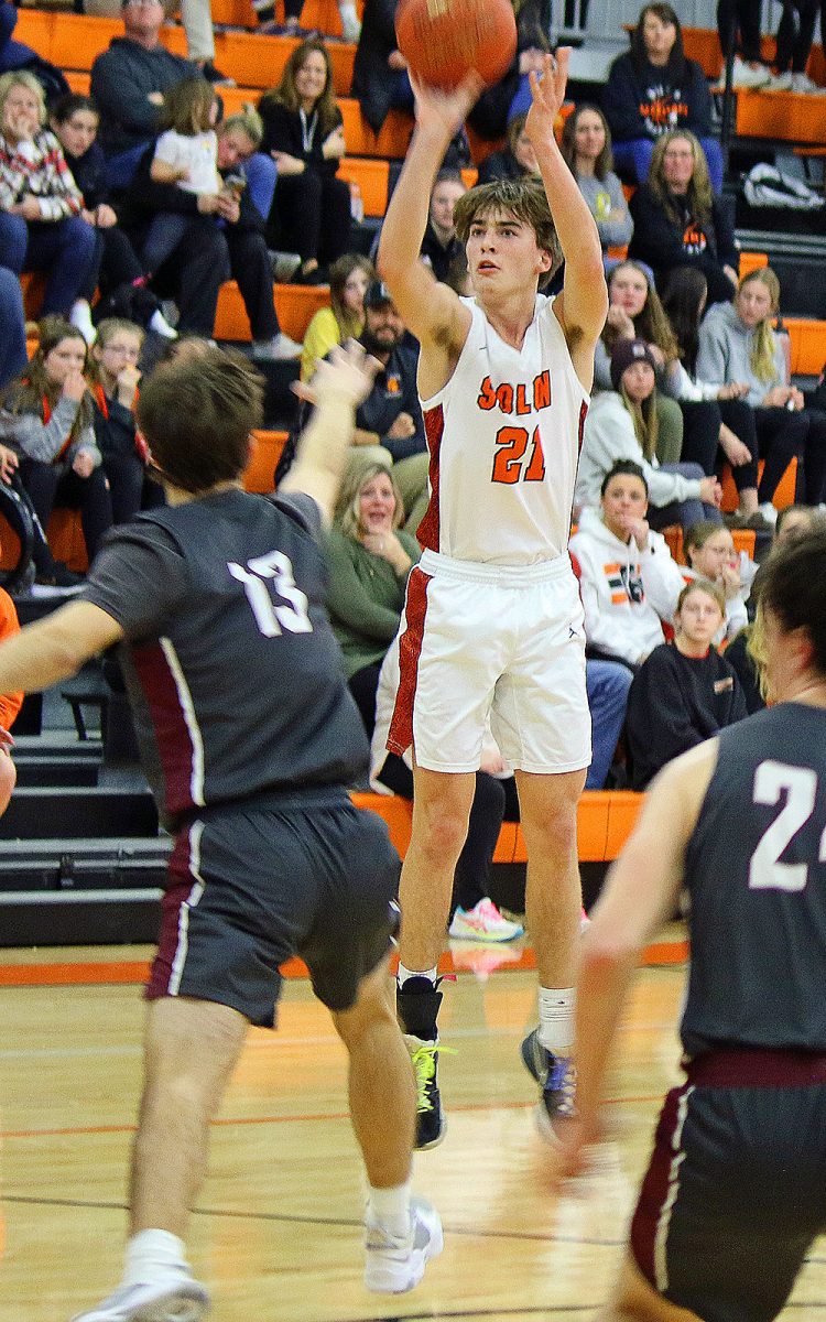 Spartan junior Oaken Foster shoots over Mustang sophomore Evan Brase at home Friday, Feb. 8, in Solon&#8217;s 55-47 triumph over Highway 1 rival Mount Vernon.