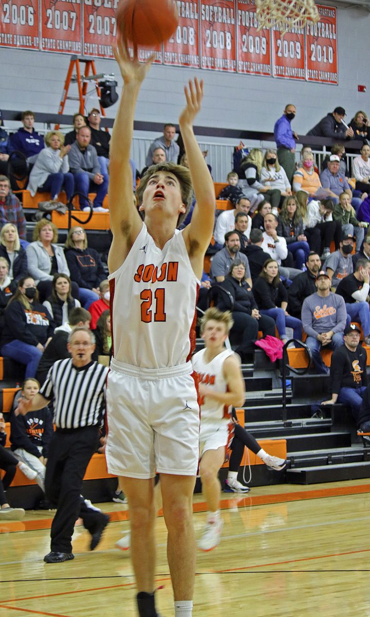 Solon junior Oaken Foster takes up an uncontested field goal during the Spartans&#8217; 53-44 triumph over the Maquoketa Cardinals, at home, Feb. 4.