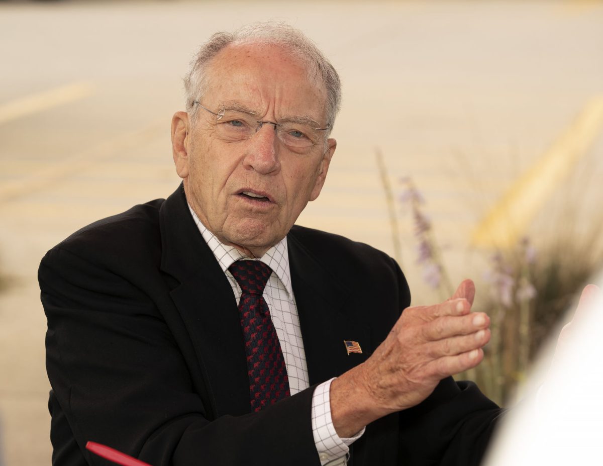 U.S. Sen. Chuck Grassley, R-Iowa, speaks with citizens and reporters during a stop on his 99-county tour in 2021.