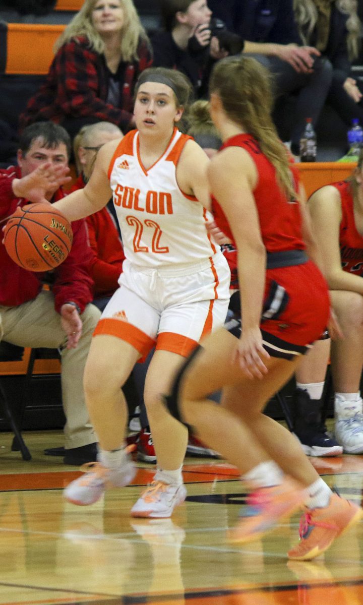 Sara Holtz turns to break toward the lane against Maquoketa&#8217;s Emma Chapin in the final moments of the fourth quarter of the Lady Spartans&#8217; 64-50 victory over the Cardinals, Feb. 4, at home.