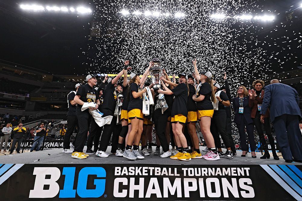 <p>The Iowa Hawkeyes celebrate with their team trophy after winning the championship game in the 2022 Big Ten Women’s Basketball Tournament.</p>