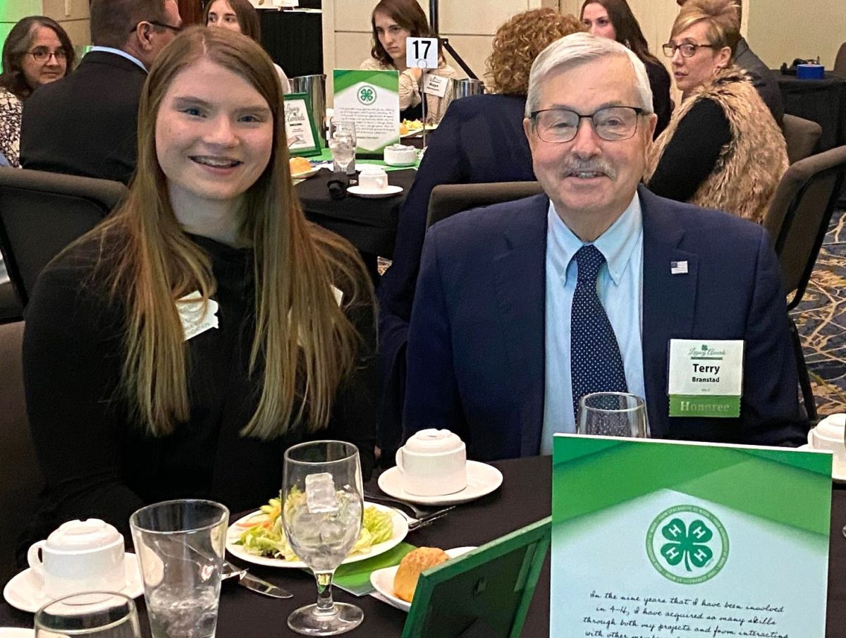 President of the MacBride&#8217;s Pride 4-H club and Youth Trustee for the Iowa 4-H Foundation Madison Craig visits with former Governor Terry Branstad at a recent 4-H Gala. The Solon High School senior credits 4-H for providing many opportunities she feels will help her in the future.