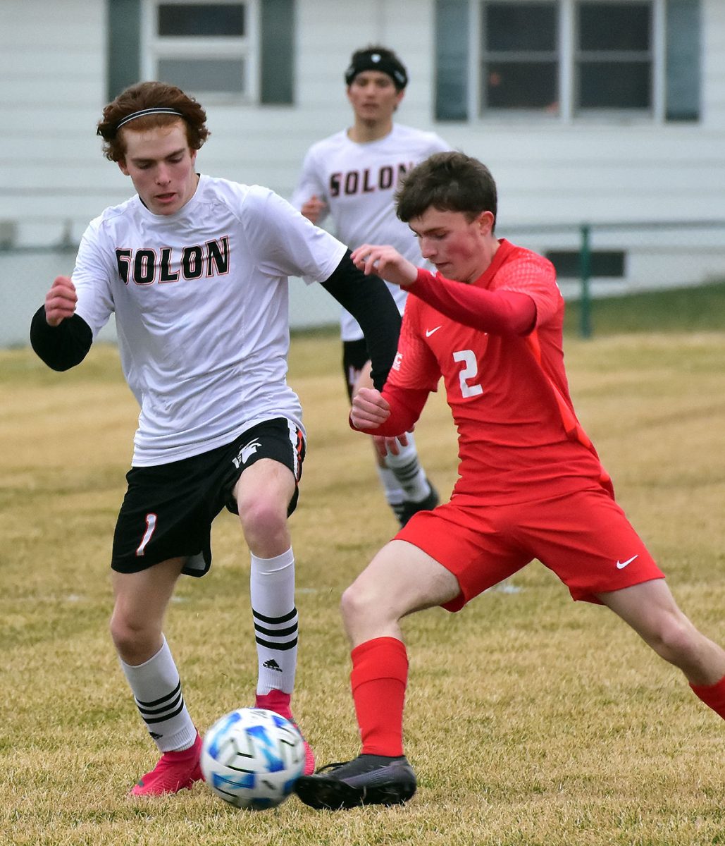 Josiah Hale battles with Marion&#8217;s Brandon Cole Tuesday, April 5, in Marion. The Wolves snapped Solon&#8217;s five-game winning streak, 2-1, in the rain.