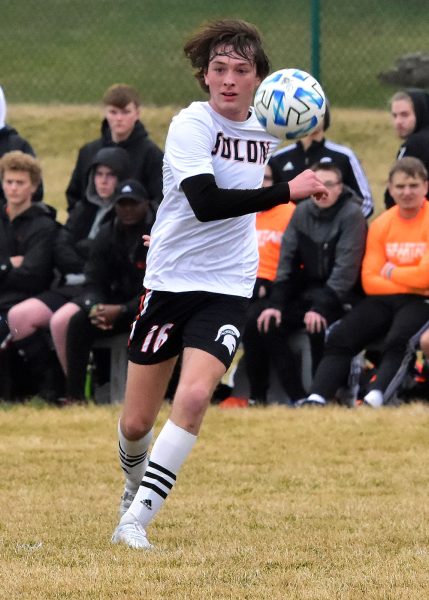 Eli Freerks has the eyes of the JV squad upon him moving the ball Tuesday, April 5, in Marion. Solon’s 5-0 streak came to an end as the Wolves won, 2-1, in the rain.