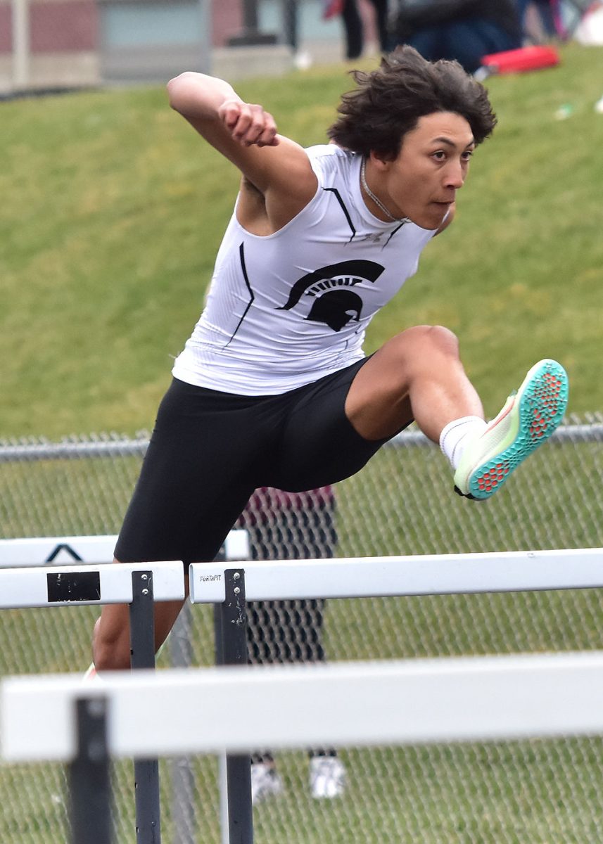 Nash Kotar leads off for the varsity Spartans in the shuttle hurdle relay Tuesday, April 19 during the Denny Gruber Co-Ed Relays. Kotar and company won the event in 1:04.98.