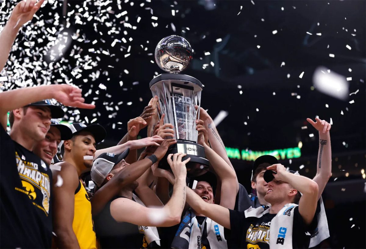 The Iowa Hawkeyes celebrate their win over Purdue in the Big Ten Tournament finals.