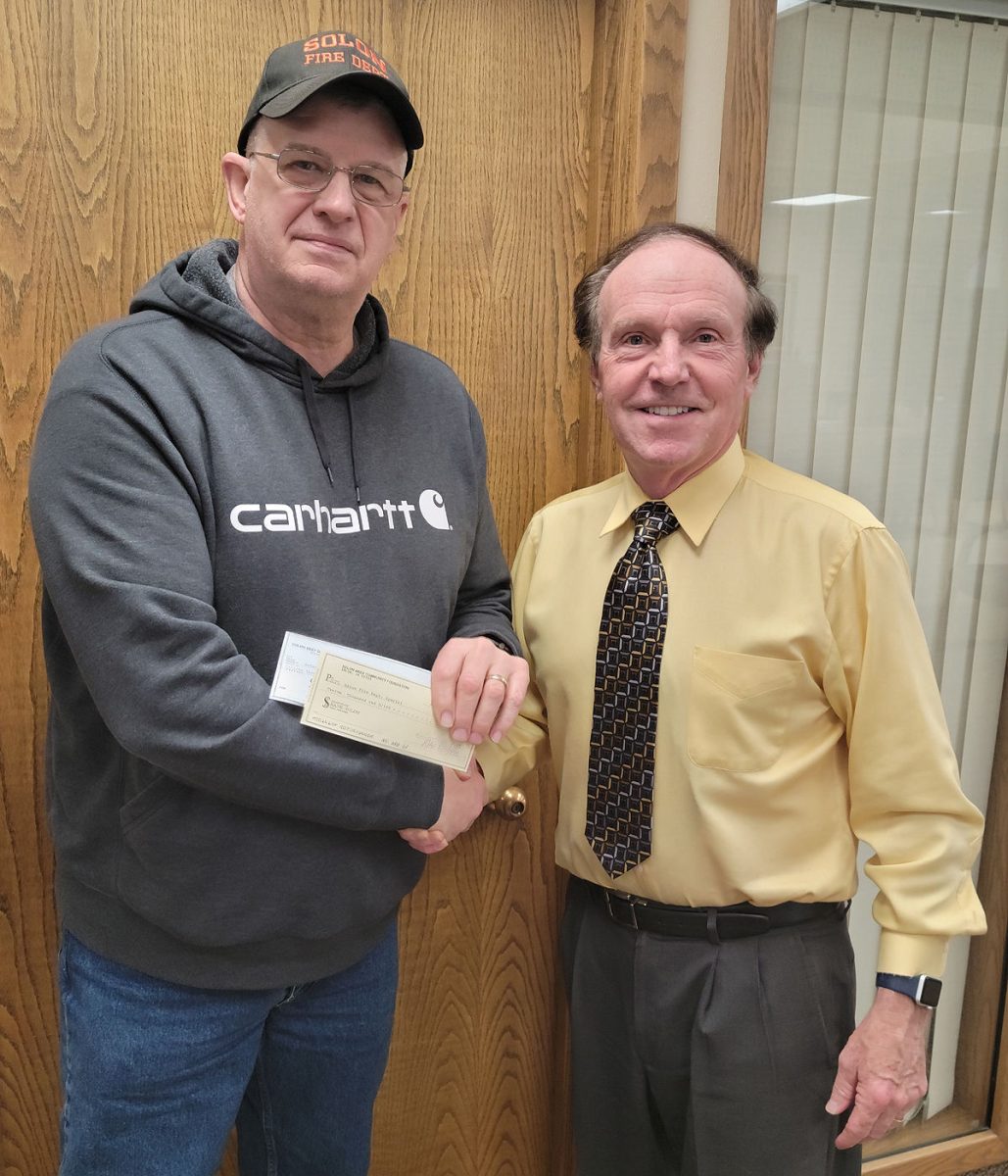 <p>Foundation donates to new Solon Fire Station</p><p>Don C. Ellis, treasurer of the Solon Area Community Foundation and treasurer of Solon Beef Days presents checks to Bob Siddell of the Solon Fire Department. $12,000 from the SACF for a Solon Fire Station Illuminated Building Sign $15,000 from Beef Days to go toward storage space to be used in lieu of a basement.</p>