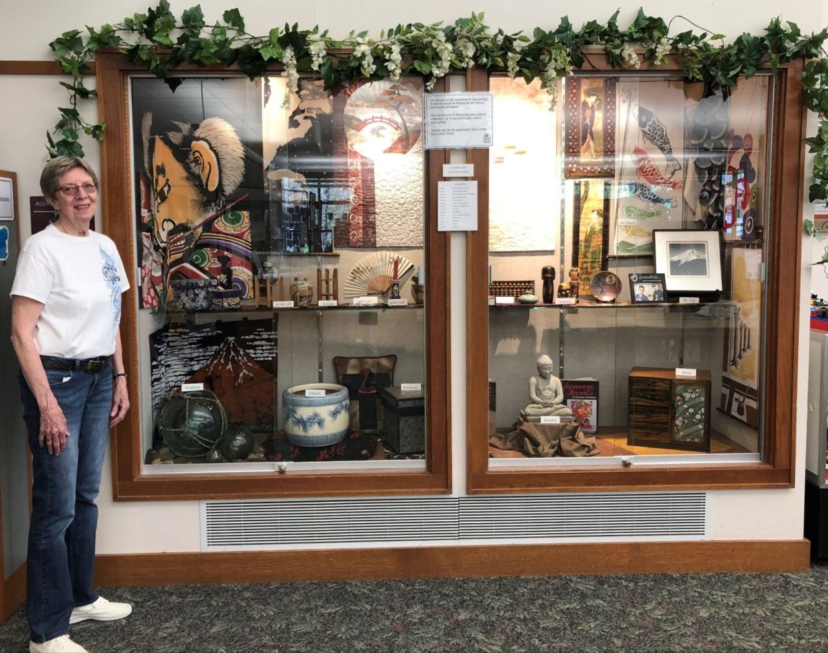 Chris Christophersen is pictured with her display of &#8220;Twelve Years in Japan&#8221;.