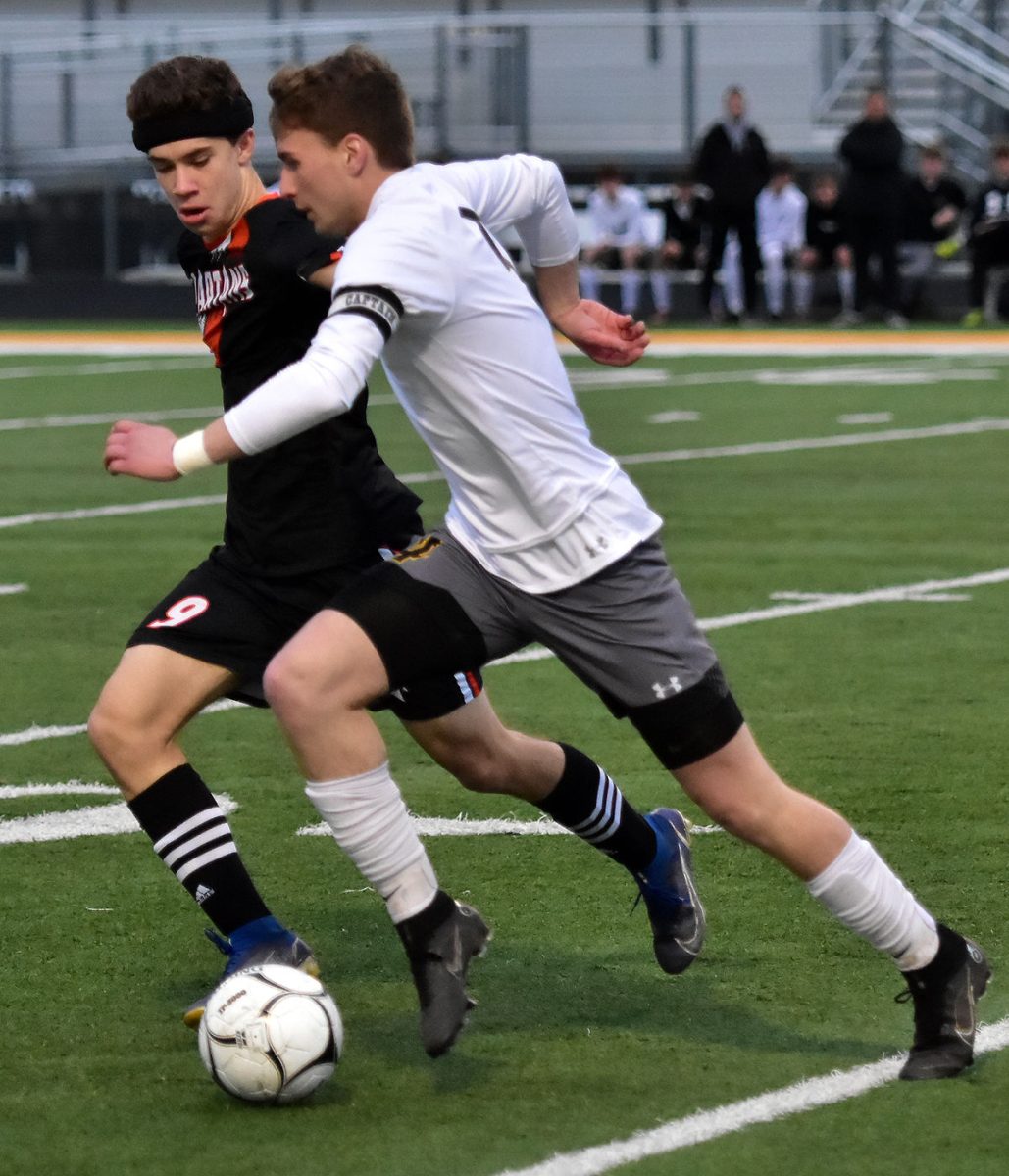 <p>William Wittich and CPU’s Gabe Hansen battle for possession down the sideline Tuesday, May 3 in Solon. The Spartans shutout the Stormin’ Pointers 4-0.</p>