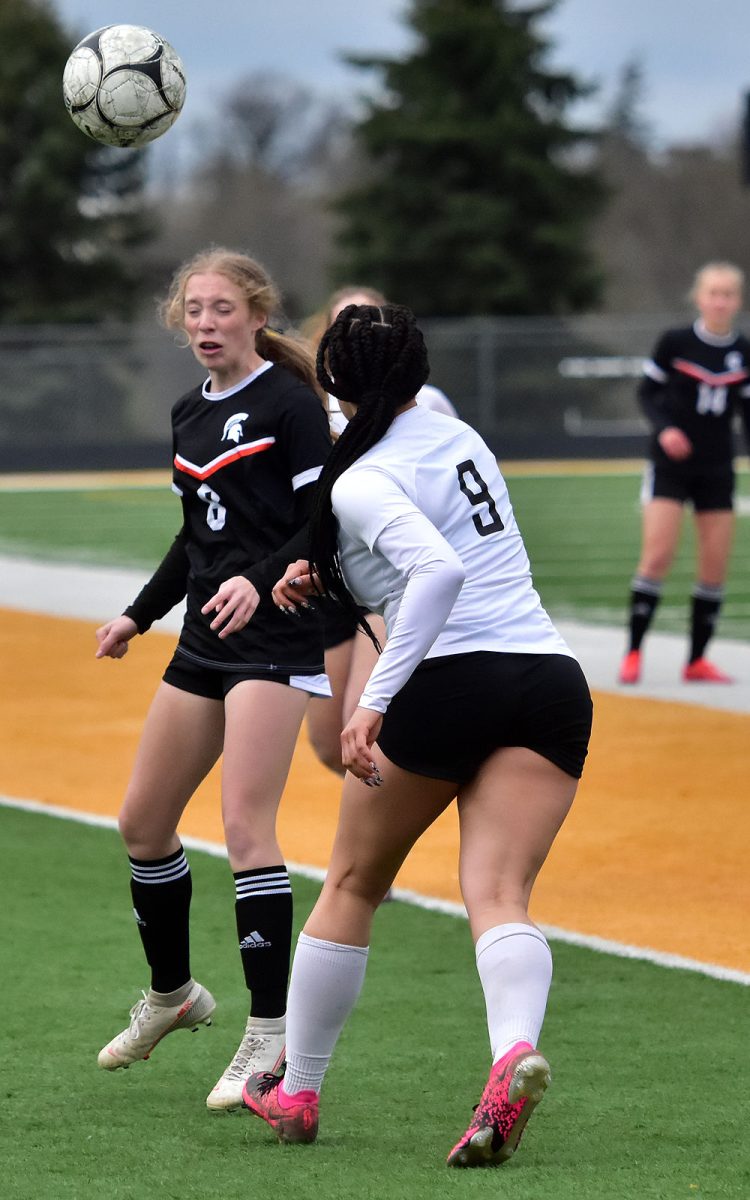 <p>Farrah Hendricks heads the ball as CPU’s Maleny Schildroth moves in to intercept Tuesday, May 3 in Solon. The Lady Spartans fell 2-1 to the Stormin’ Pointers.</p>