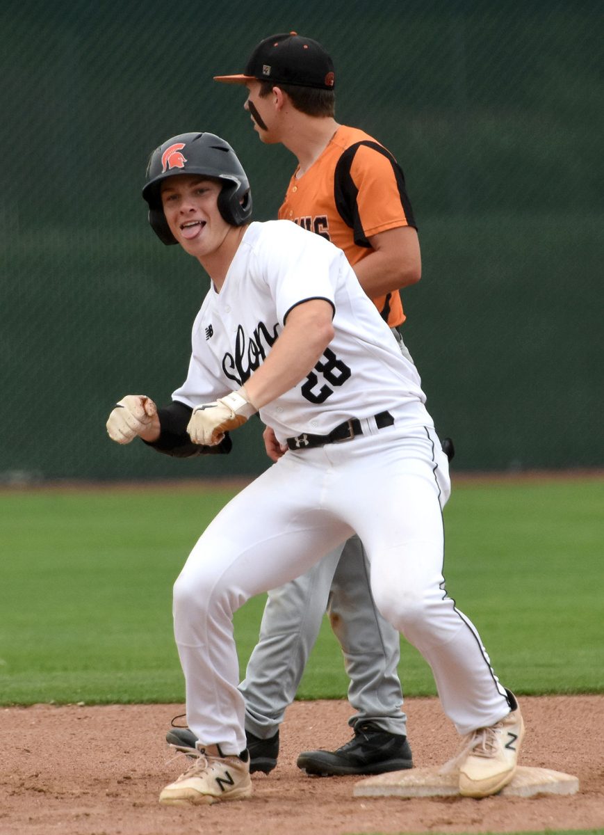 Brett White does a little celebratory dance after stealing second base Wednesday, June 15 in a non-conference game against Fairfield. White later blasted a grand slam homerun as the Spartans shutout the Trojans 15-0.