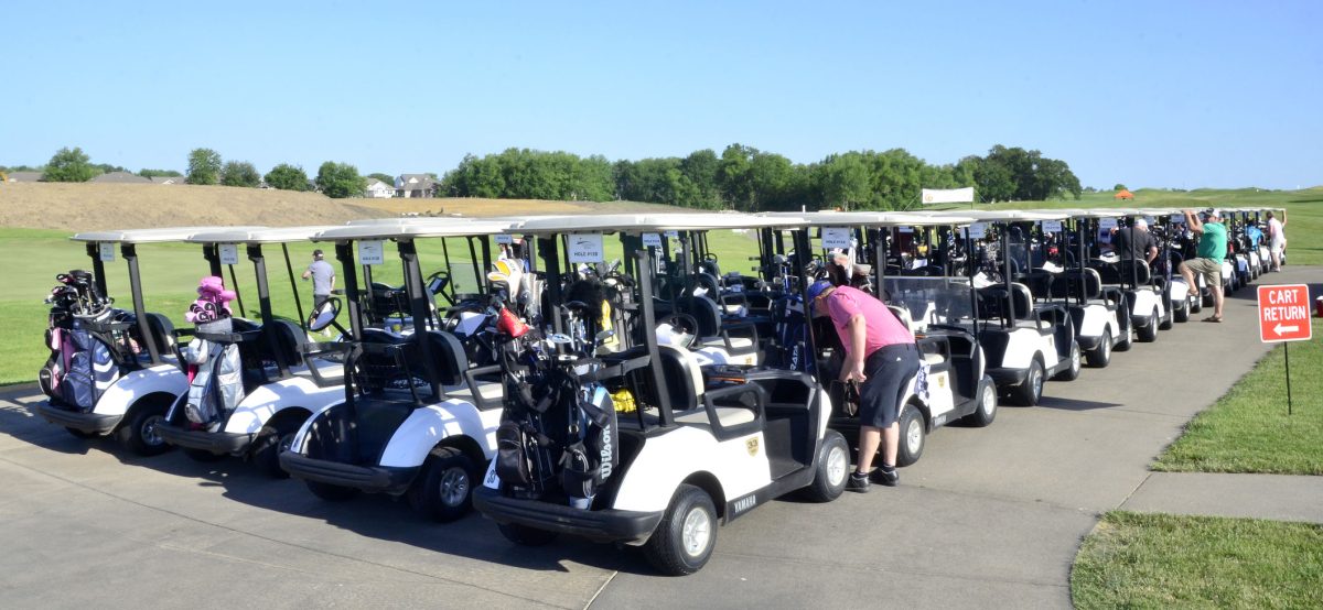 A fleet of golf carts sits lined up and ready to go before the start of the American Legion of Iowa Foundation&#8217;s annual tournament at the Saddleback Golf Course Monday, June 20. The event raises funds, which are disbursed to non-profit organizations across the state.