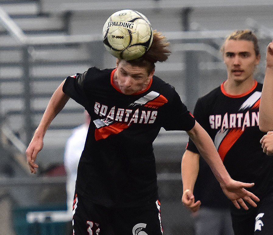 Dillon Bruck fires a header at Independence’s goal Monday, May 23 in a Class 2A substate match. The Spartans won 7-0 with four goals from Bruck, a senior.