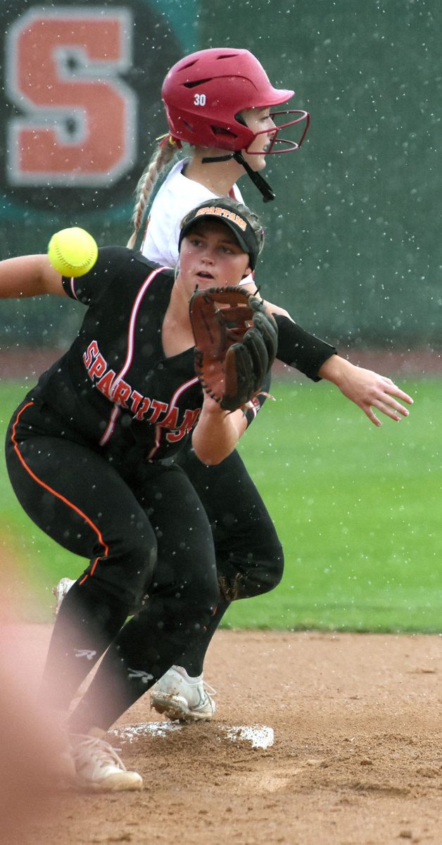 The ball gets to Hilary Wilson just a little late as Marion&#8217;s Maddy Kann is already safely aboard second base in a Class 4A Region 7 quarterfinal game at home Thursday, July 7. Marion won 7-6 in nine innings to end Solon&#8217;s season.