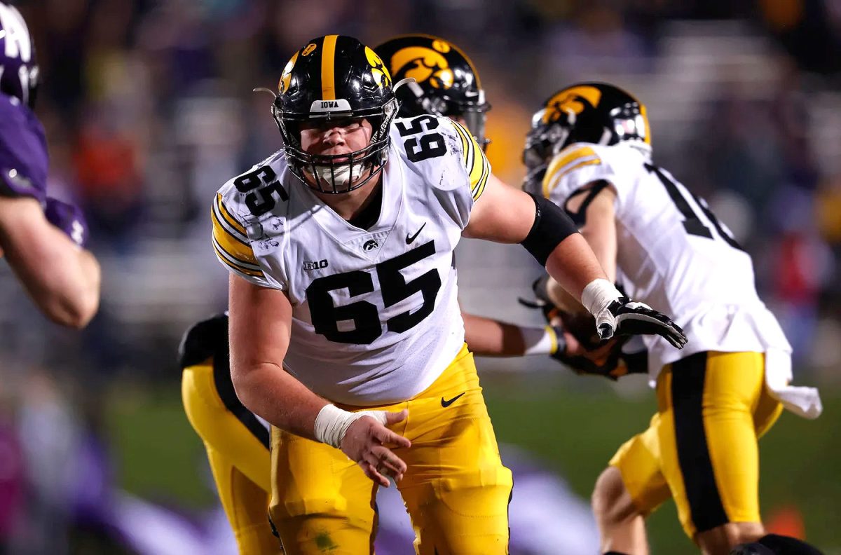 <p>Offensive lineman Tyler Linderbaum blocks against the Northwestern Wildcats Saturday, Nov. 6, 2021, at Ryan Field.</p>