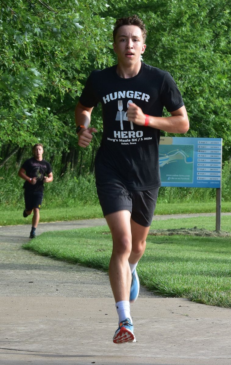 Grant (front) and Collin Bumsted run in the Be a Hunger Hero 5k race Saturday, August 6 on the Solon Recreation and Nature Area&#8217;s trails. Grant was third overall in 20:46.03 while Collin was fourth in 20:50.49.