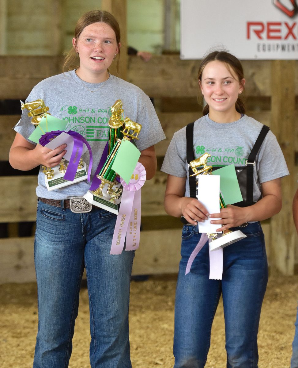 <p>Julia Steinbrech (left) and Rose McAtee hold their trophies from the Market Beef Show Wednesday, July 27 at the Johnson County Fair. Julia is a member of the Graham Champions 4-H club while Rose is a member of Macbride’s Pride 4-H club.</p>