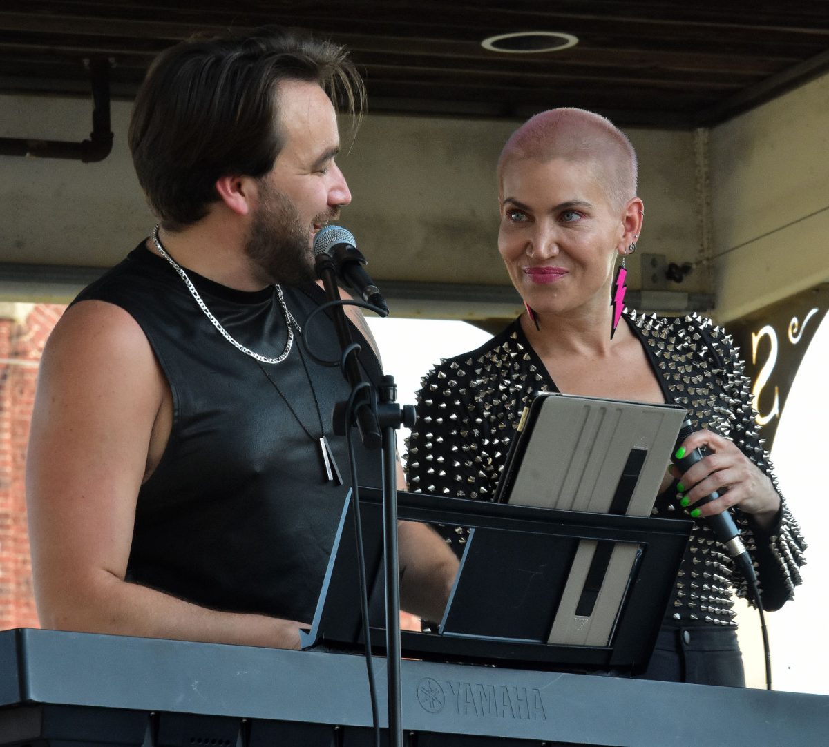 Alex Newkirk and Molly Callinan share friendly banter Wednesday, July 27 during their performance in the Music on Main concert series.