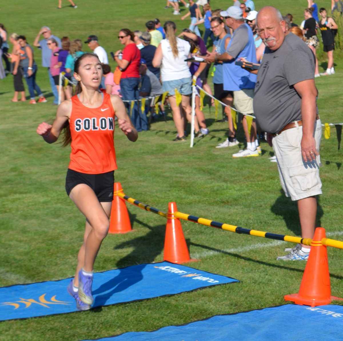 <p>Kayla Young hits the electronic finish line in 20:13 taking the girls’ title at the 49th Tipton cross country invitational.</p>