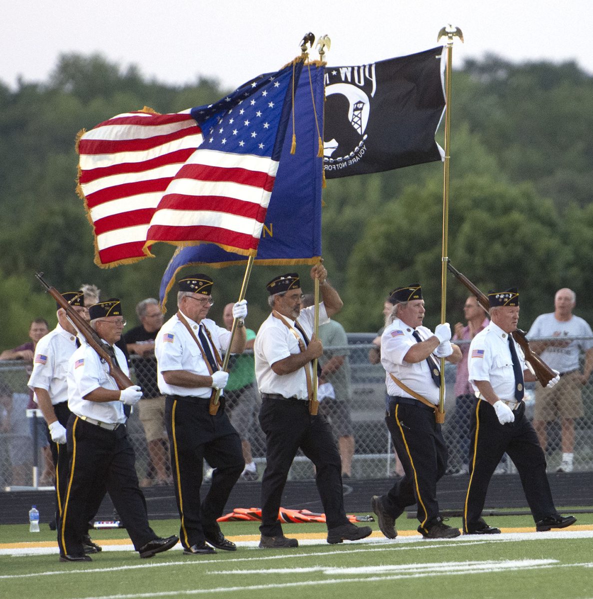 <p>Solon American Legion Stinocher Post 460 and Mount Vernon American Legion Hahn Howard Post 480 members present the colors ahead of the annual rivalry game between the Spartans and Mustangs Friday, Sept. 2 in Solon.</p>