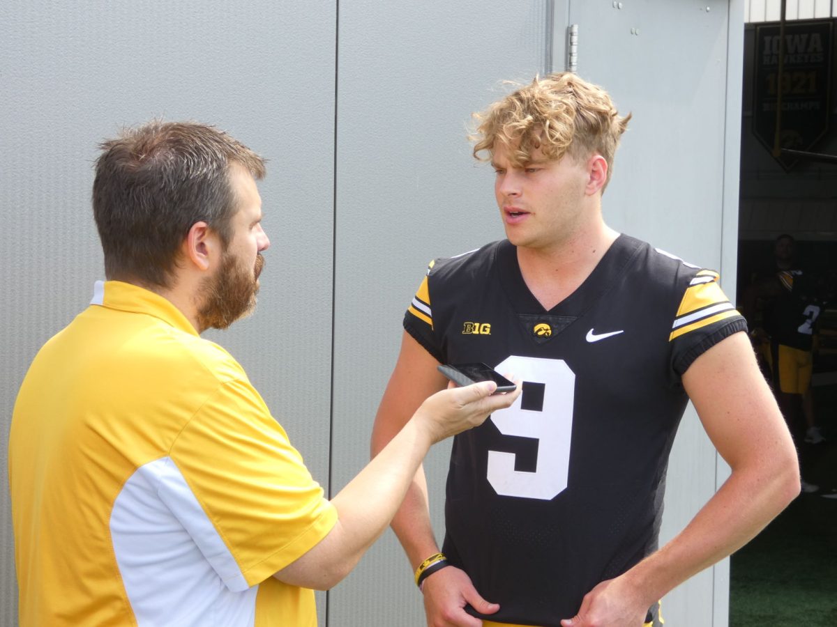 <p>Tory Taylor speaks with a reporter during the annual Media Day event.</p>