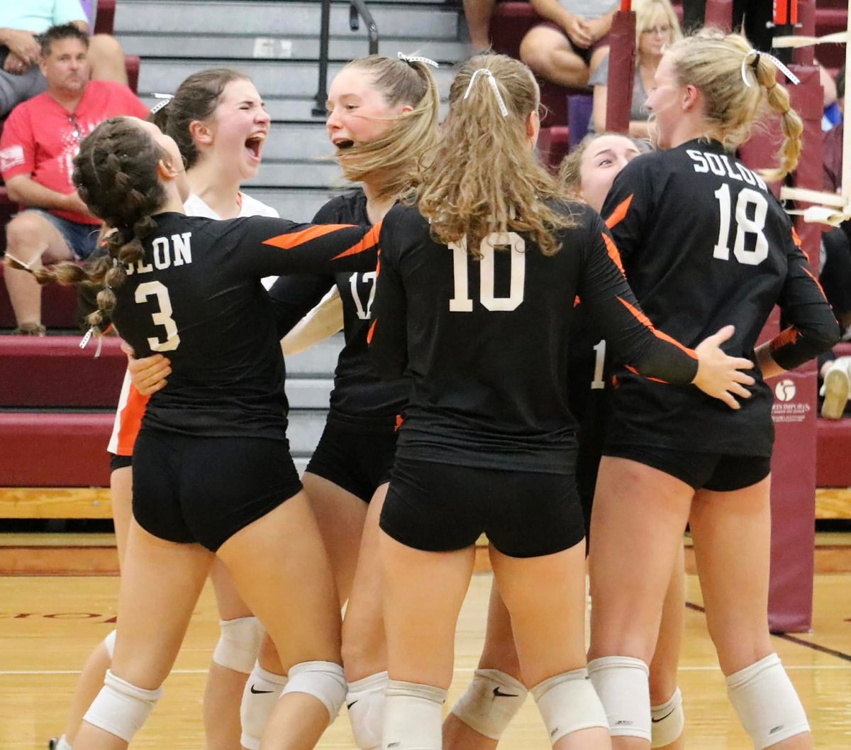 The Lady Spartans celebrate a point against archrival Mount Vernon Tuesday, Sept. 6 in the Mustangs&#8217; stable.