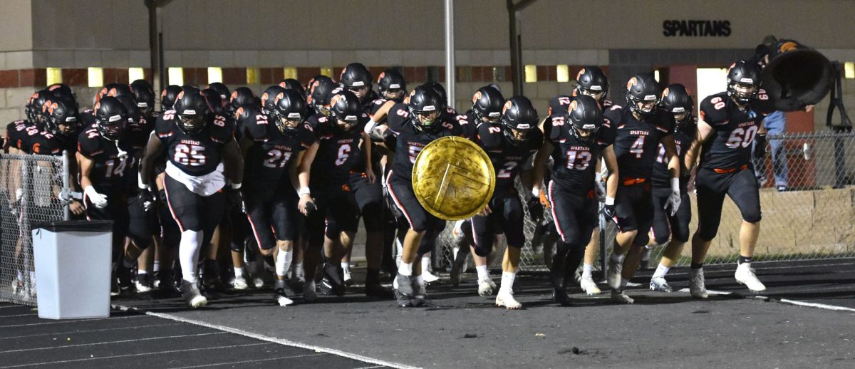 <p>The varsity Spartans storm the field to take on the Washington (Iowa) Demons for the Homecoming game Friday, Sept. 30. Solon picked up their third consecutive win with a 44-0 shutout, the third of the season.</p>