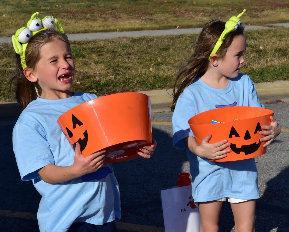 Zoey Struzynksi (left) and Ivy Elsasser handed out candy for the Solon Learning Academy.