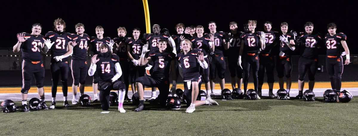 The seniors pose for a group photo after wiping out Grinnell 51-7 on Senior Night, clenching the 3A District 5 Championship, and putting up their fifth-consecutive win.