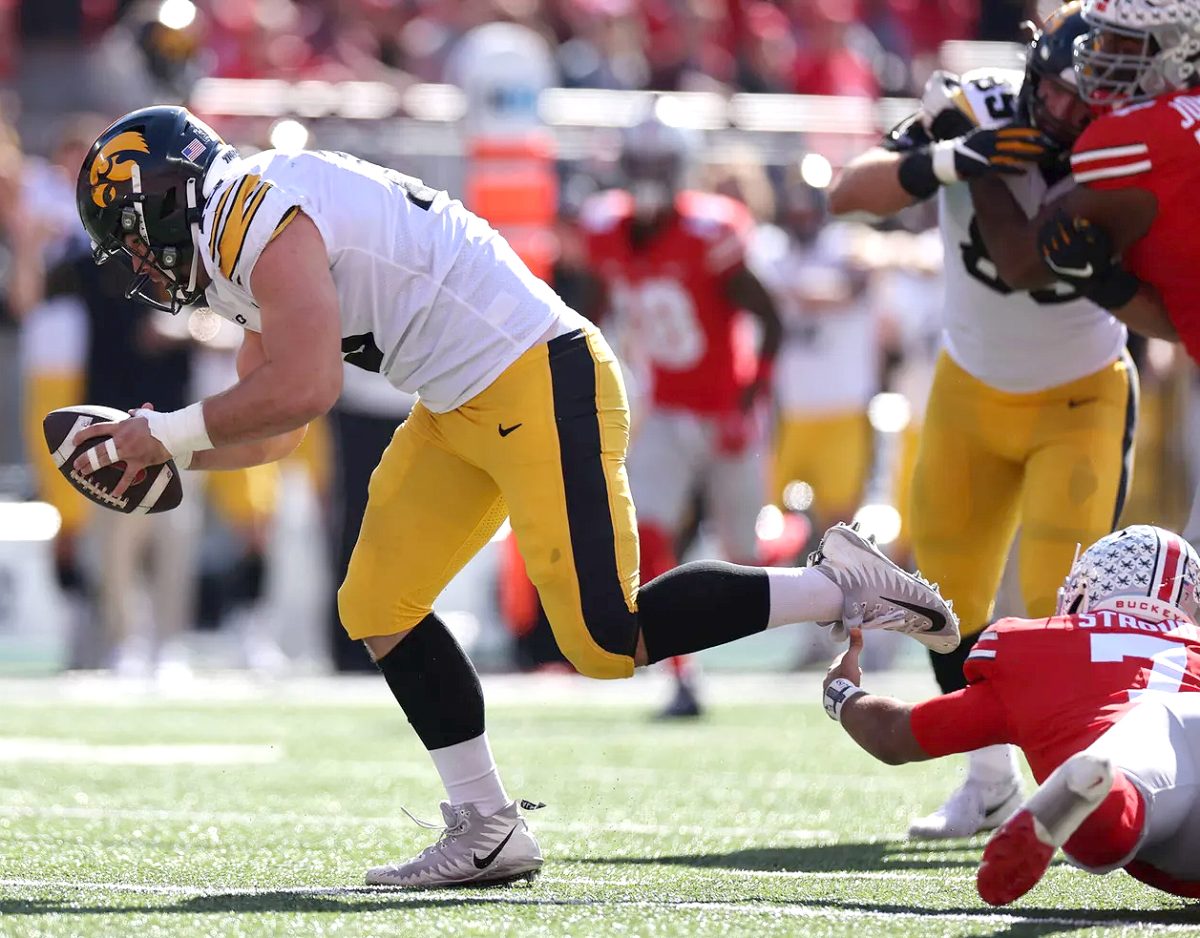 <p>Defensive end Joe Evans (3) scoops up a fumble for a score against the Ohio State Buckeyes Saturday, October 22 at Ohio Stadium in Columbus, OH.</p>