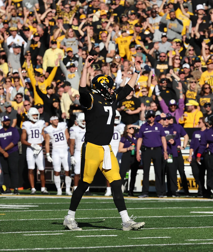 Quarterback Spencer Petras (7) celebrates a touchdown against the Northwestern Wildcats Saturday, October 29 at Kinnick Stadium.