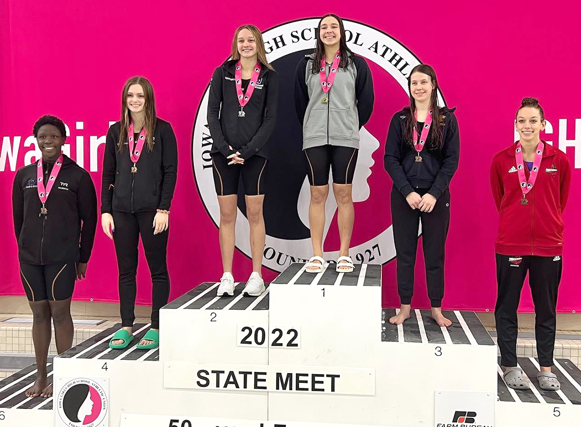 Grace Hoeper (1) won the 50-yard freestyle event Saturday, Nov. 12 at the 2022 Girls State Swimming and Diving Meet in Marshalltown. Also on the podium with Hoeper are Athieno Wandera (6th), Hayden Bailey (4th), Payden Rafferty (2nd), Maria Trotta (3rd), and Anna Gute (5th).