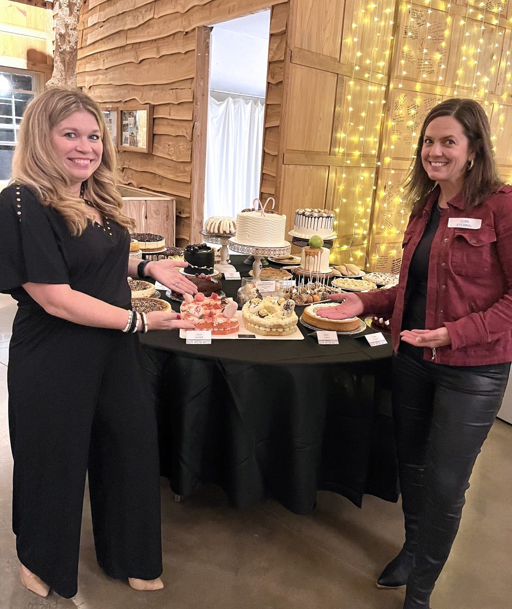 Amanda Stahle and Lori Stebral showcase the array of desserts available at the Solon Dollars for Scholars Gala and Auction. The annual event was held at the Celebration Barn Nov. 5 and raised over $100,000 for scholarships for Solon High School graduates going on to a college or university. Next year&#8217;s gala is set for Saturday, October 28.