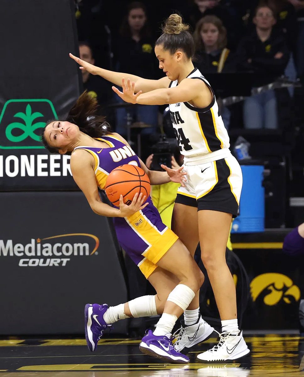 Gabbie Marshall (24) plays defense against the UNI Panthers on Girl Scout Day Sunday, Dec. 18 at Carver-Hawkeye Arena.