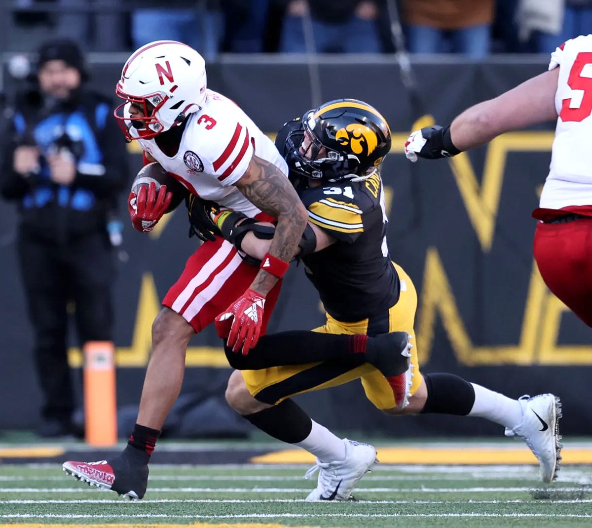 Jack Campbell makes a tackle against the Nebraska Cornhuskers in the Scheels Heroes Game Friday, Nov. 25 at Kinnick Stadium.