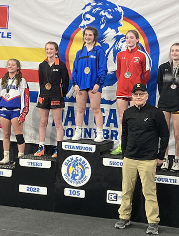 McKenna Rogers (2nd from left) placed third at 105 pounds for Solon in the Dan Gable Donnybrook high school wrestling tournament Friday and Saturday, Dec. 1 and 2, at the Xtreme Arena in Coralville.