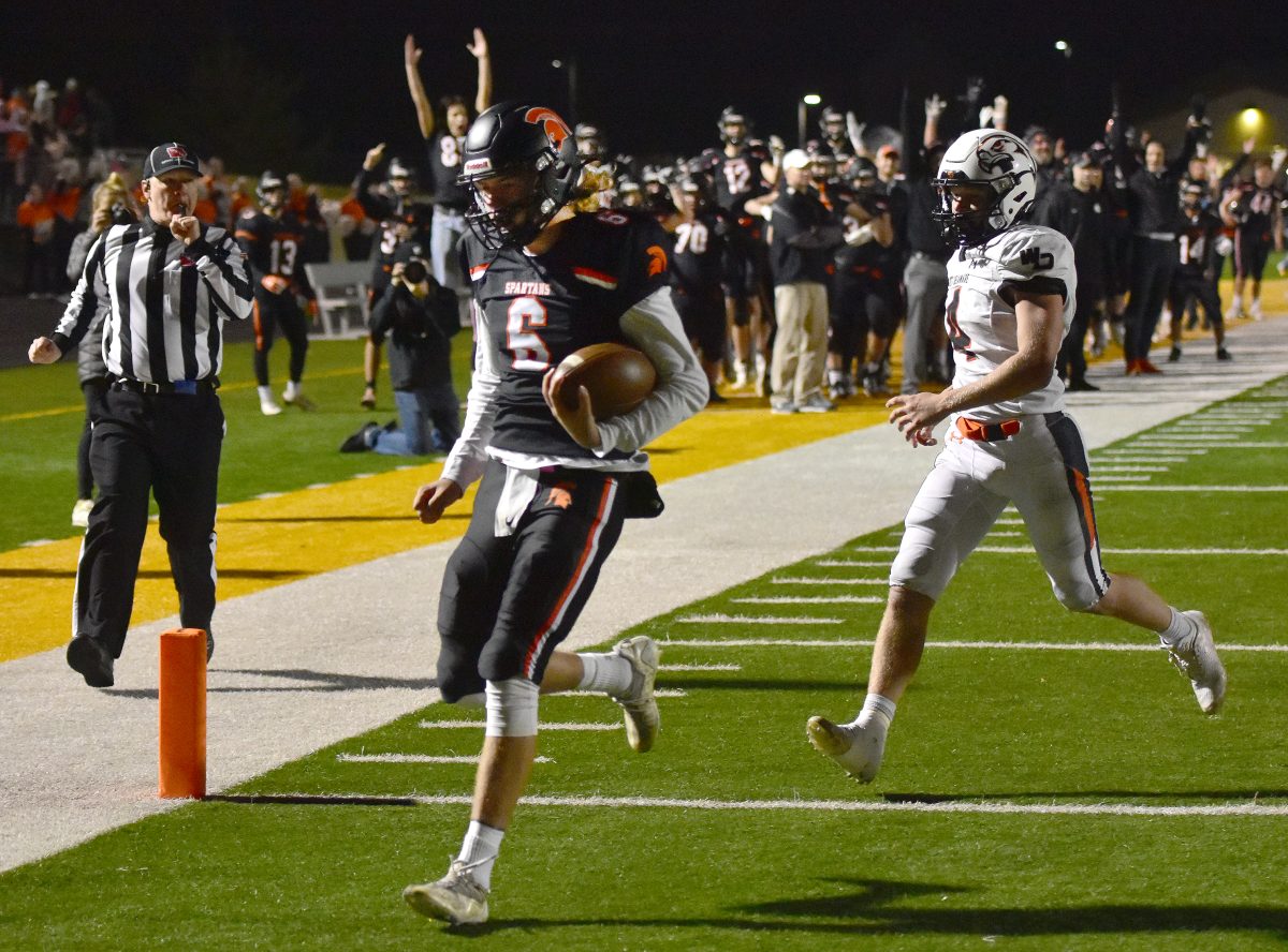 The sideline erupts as Brayden Ruskey scores a touchdown late in the fourth quarter of a 3A first round match up against West Delaware October 28 at home. Ruskey&#8217;s score made it 41-12 and Solon went on to win 42-18 to advance to the second round.