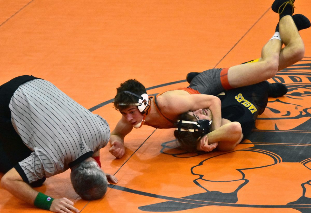 Jordan Schmidt looks for the pin against Midland&#8217;s Shayden Hansen in a 132-pound match Thursday, Feb. 2 in the Solon Duals. Schmidt won by fall in 1:57.