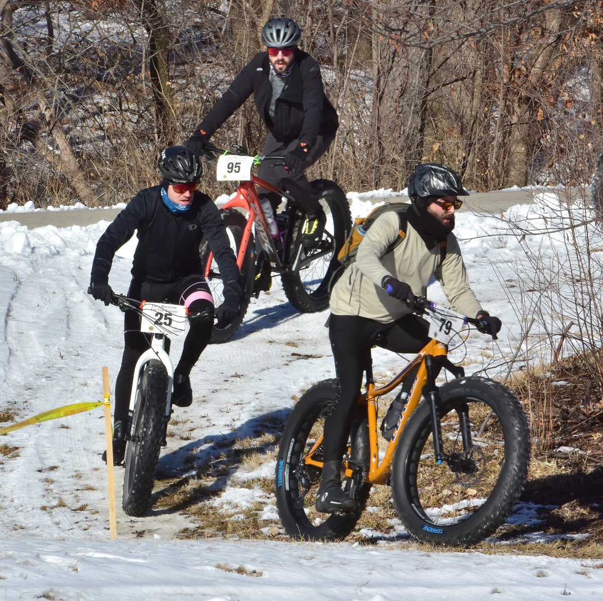 Rob Halden (79) leads Kent Ralston (25) and Nate Walker (95) around and down a sharp curve Saturday, Feb. 11 during the sixth annual Fat Tire Classic bike race at Lake MacBride State Park. Halden was 115th, Ralston was 114th, and Walker was 95th in the event, which raises money for the Solon Centennial Lions Club. More photos: 12A.