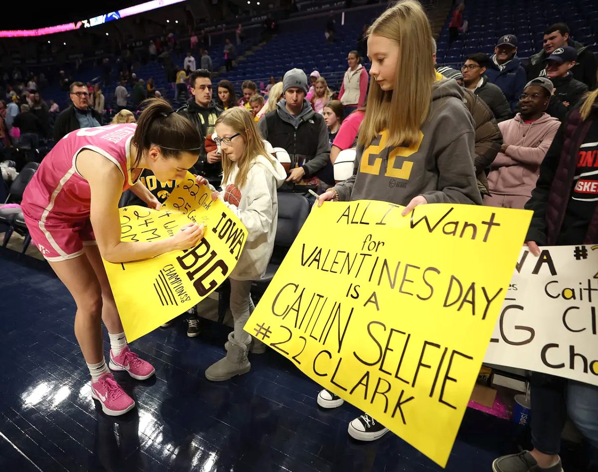 Caitlin Clark signs autographs following the Iowa Hawkeyes&#8217; win against the Penn State Nittany Lions Sunday, Feb. 5 at the Bryce Jordan Center in State College, PA.