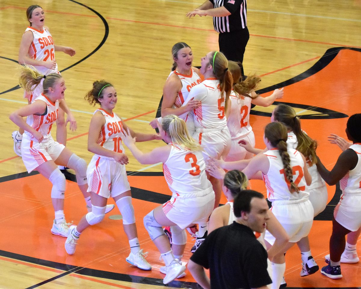 The Lady Spartans celebrate a 50-49 win over Mount Vernon Friday, Feb. 3. It was the second win over their rival this season and sealed the WaMaC East Championship.