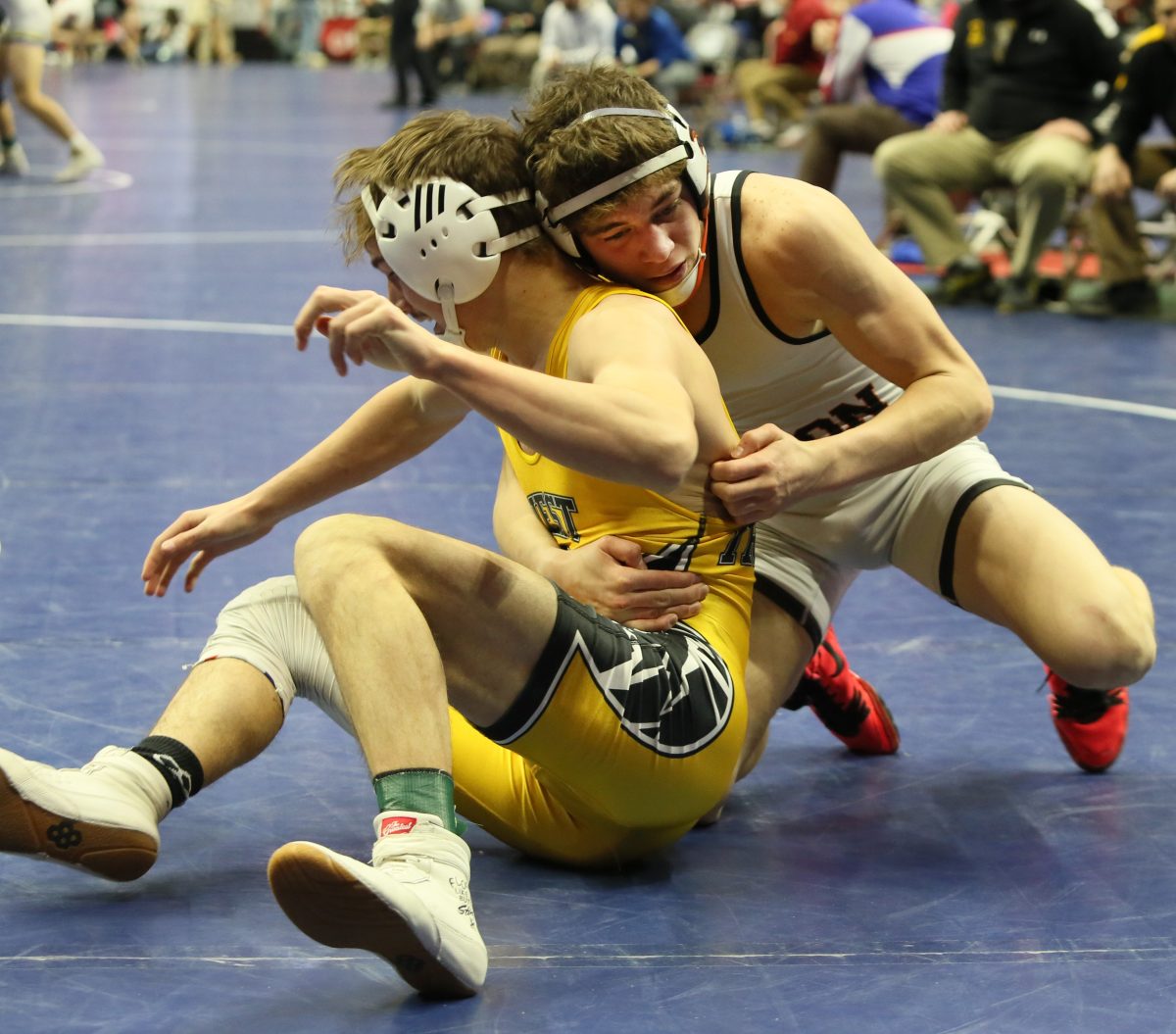 Jordan Schmidt works on West Marshall&#8217;s JD Downs in the third consolation round at the 2023 State Wrestling Championships at Wells Fargo Arena in Des Moines. Schmidt took an 8-6 decision from West Marshall&#8217;s JD Downs (32-13) in the second of three consolation round victories on his way to a seventh-place medal at 132 pounds.