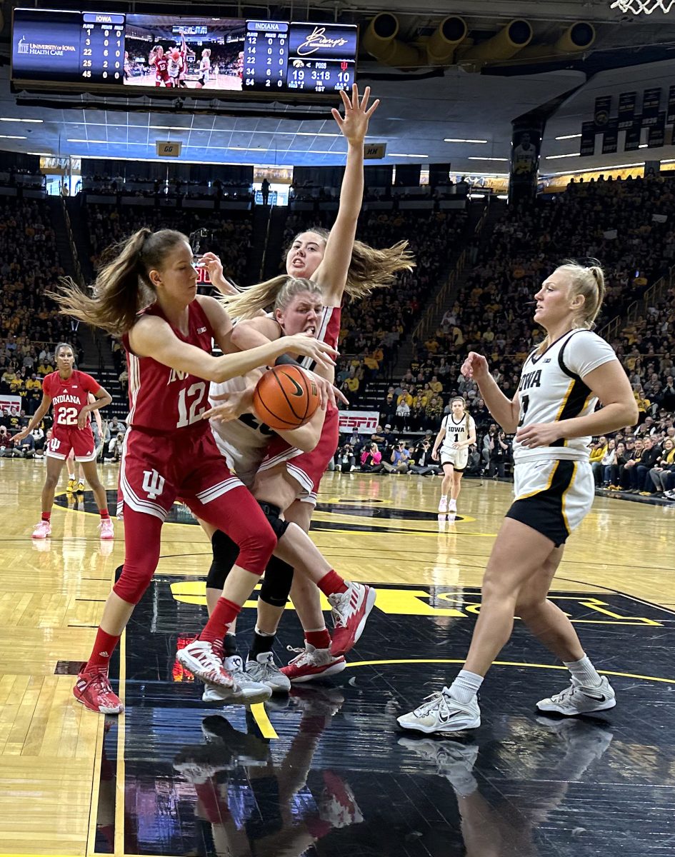 Monika Czinano (25) gets the ball stripped away while attempting a shot against the Indiana Hoosiers, Sunday, Feb. 26 at Carver-Hawkeye Arena.