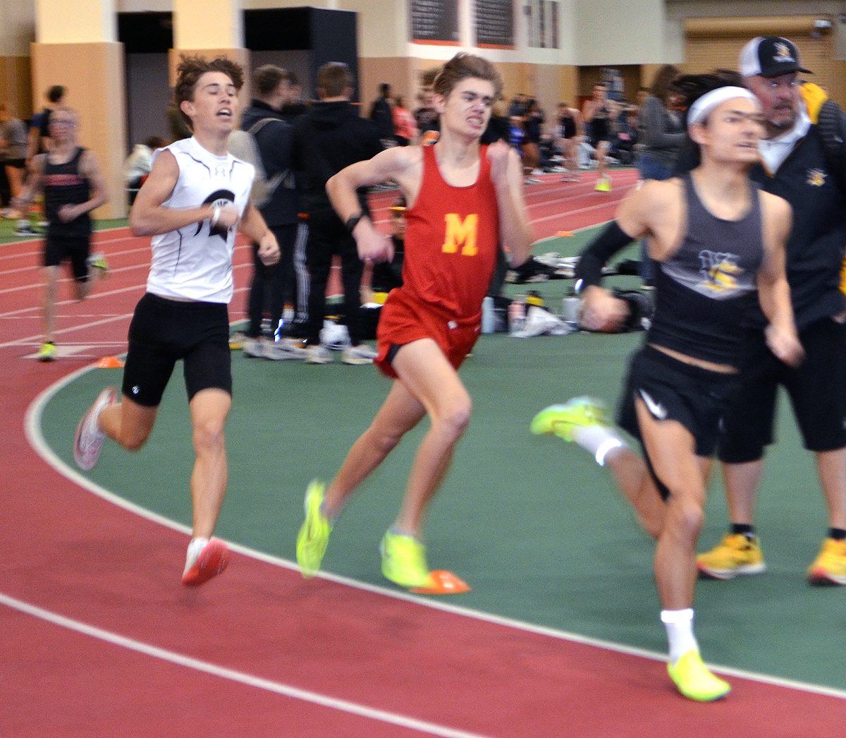 Brick Kabela makes a turn in the 1600-meter run Saturday, March 18 at the WaMaC Indoor meet in Grinnell. Kabela finished fifth in 4:48.98.