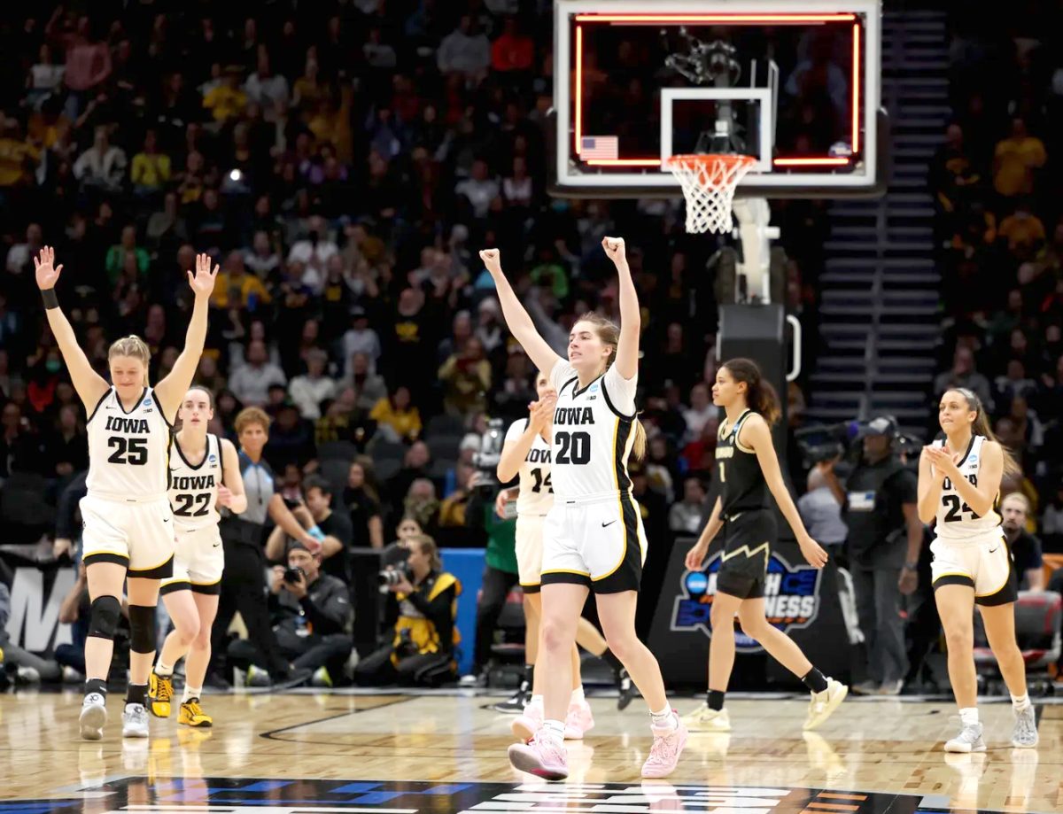 Iowa Hawkeyes guard Kate Martin (20), forward/center Monika Czinano (25), guard Caitlin Clark (22), forward/guard McKenna Warnock (14), and guard Gabbie Marshall (24) celebrate their win in the 2023 NCAA Women&#8217;s Basketball Tournament Sweet 16 game against the Colorado Buffalos Friday, March 24 in Seattle.