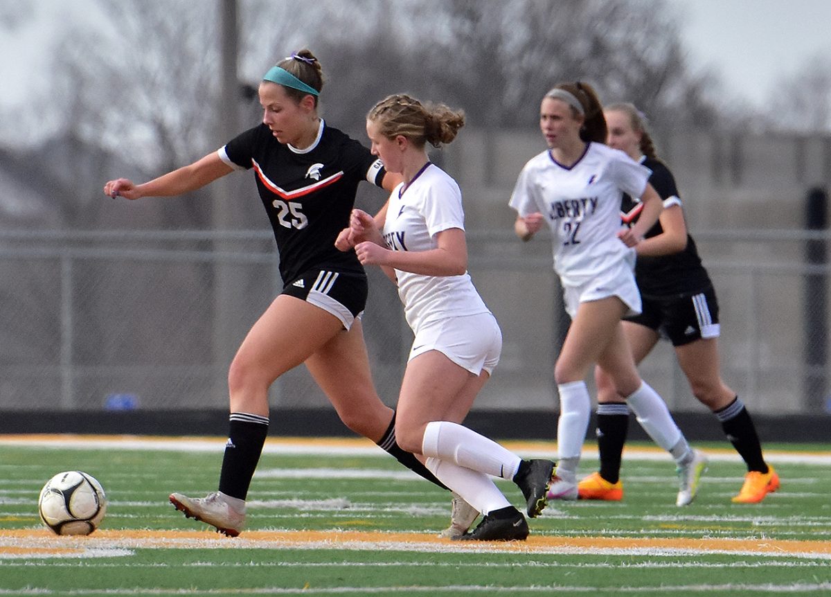 Gabby Knipper, a junior, drives the ball in a scrimmage against Liberty High School (North Liberty) Friday, March 4. Knipper earned First Team All-Conference honors last year with seven goals scored.