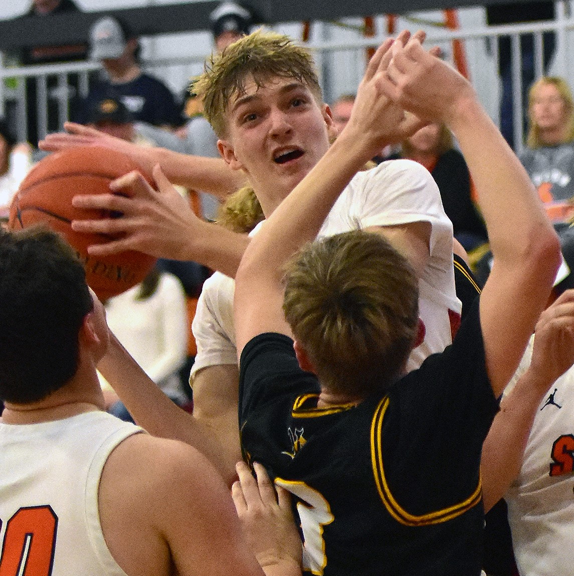 Jake Benzing grabs a rebound Tuesday, Dec. 6 against Vinton-Shellsburg. Benzing, who led the Spartans with 407 points this season, was a unanimous WaMaC East All Conference Boys Basketball First Team pick.